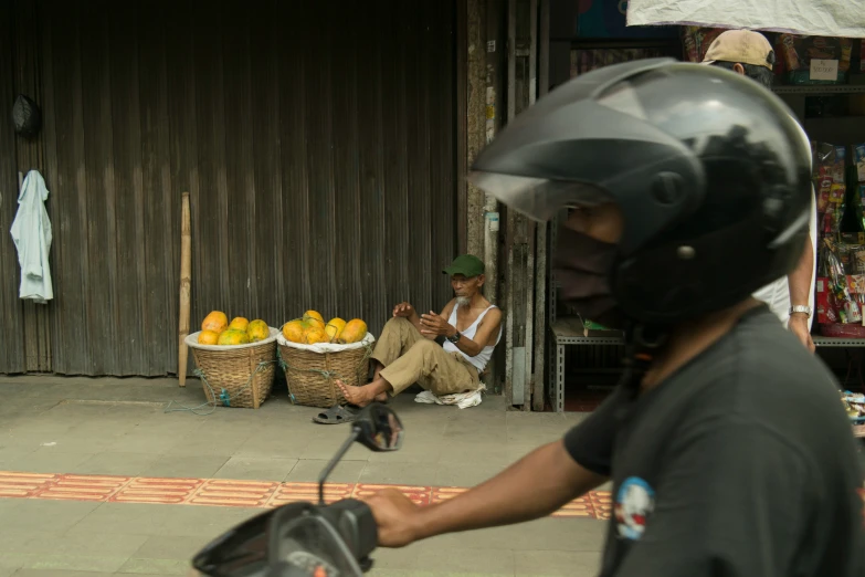 there are two people riding motorcycles outside of a store