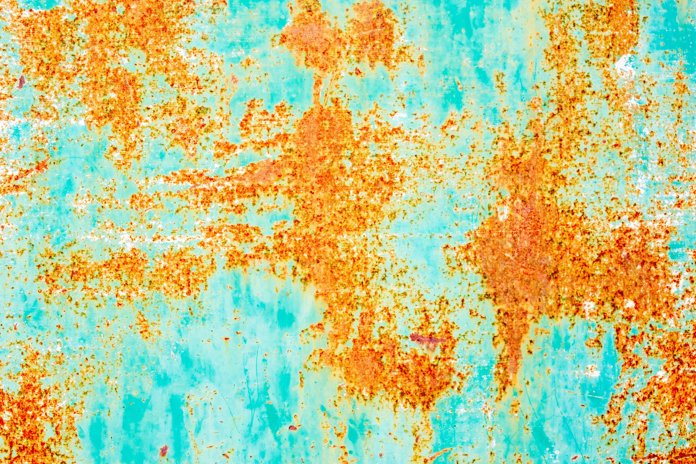 some brown, green and blue paint on the surface of a wall