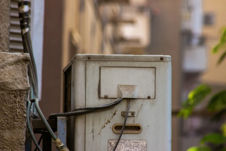 a telephone that is on the ground near a building