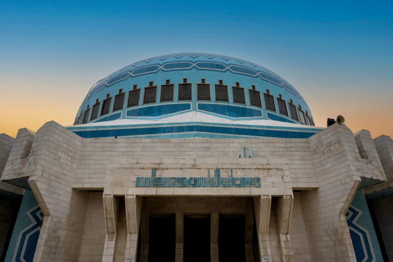 a building with a blue dome and a red and blue window