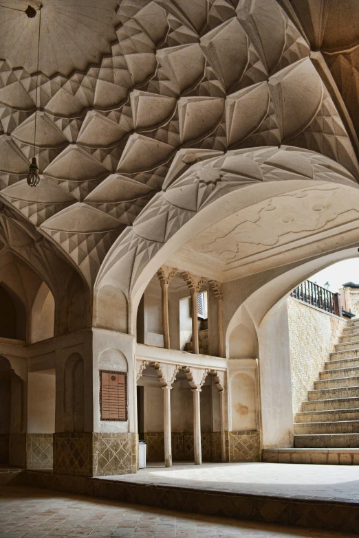 a po of a building with a staircase and a large ceiling