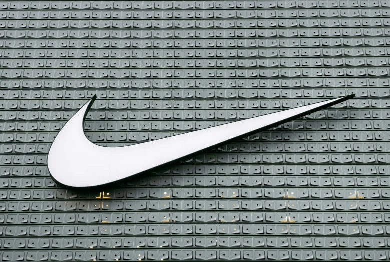 the nike logo is painted on the side of a wall