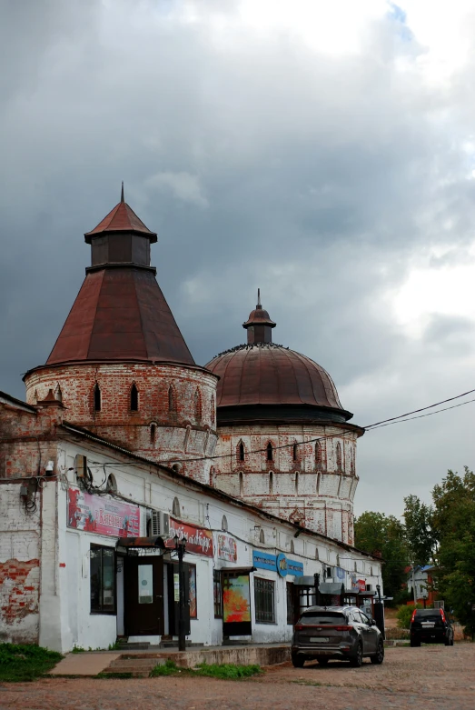 an old building with two massive round towers