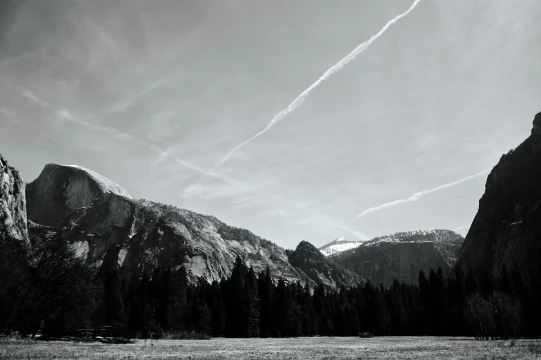 a black and white po with a plane in the sky