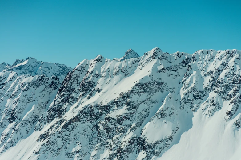 a po taken looking up at the tops of some mountain