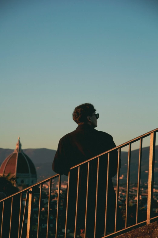 a person standing at the top of some steps