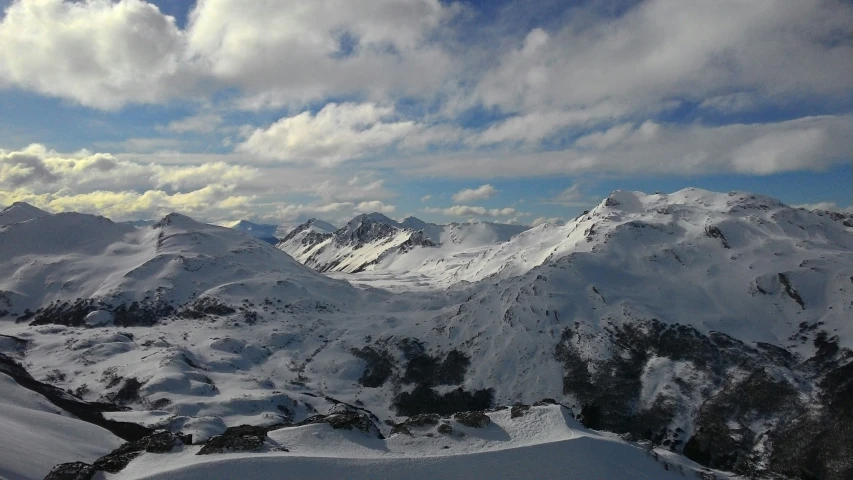 a group of mountains that have snow on them