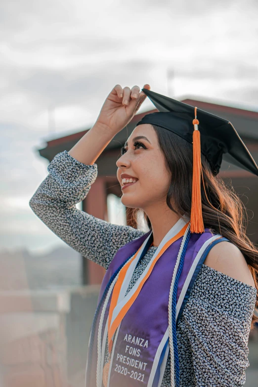 the female student wears an award stole during graduation