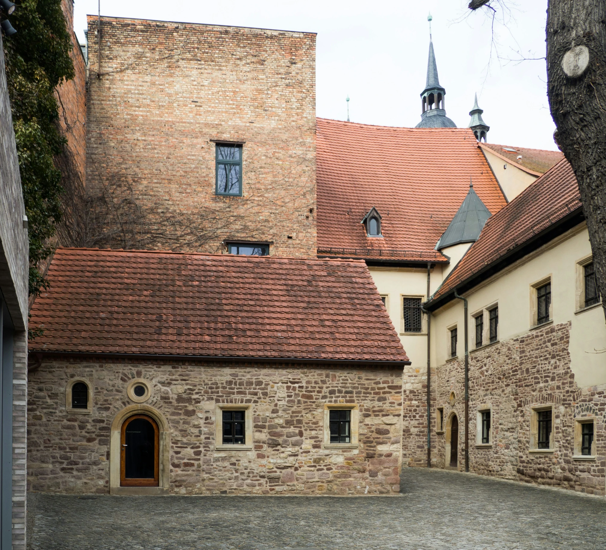 an image of an old house with two clock towers