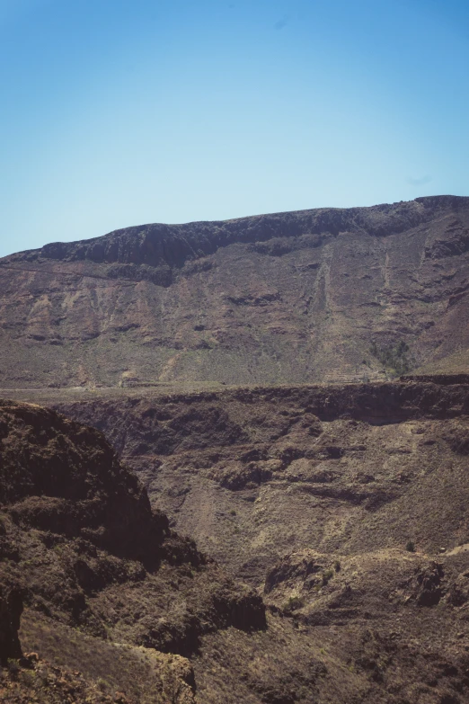 a view of mountains in the distance with trees