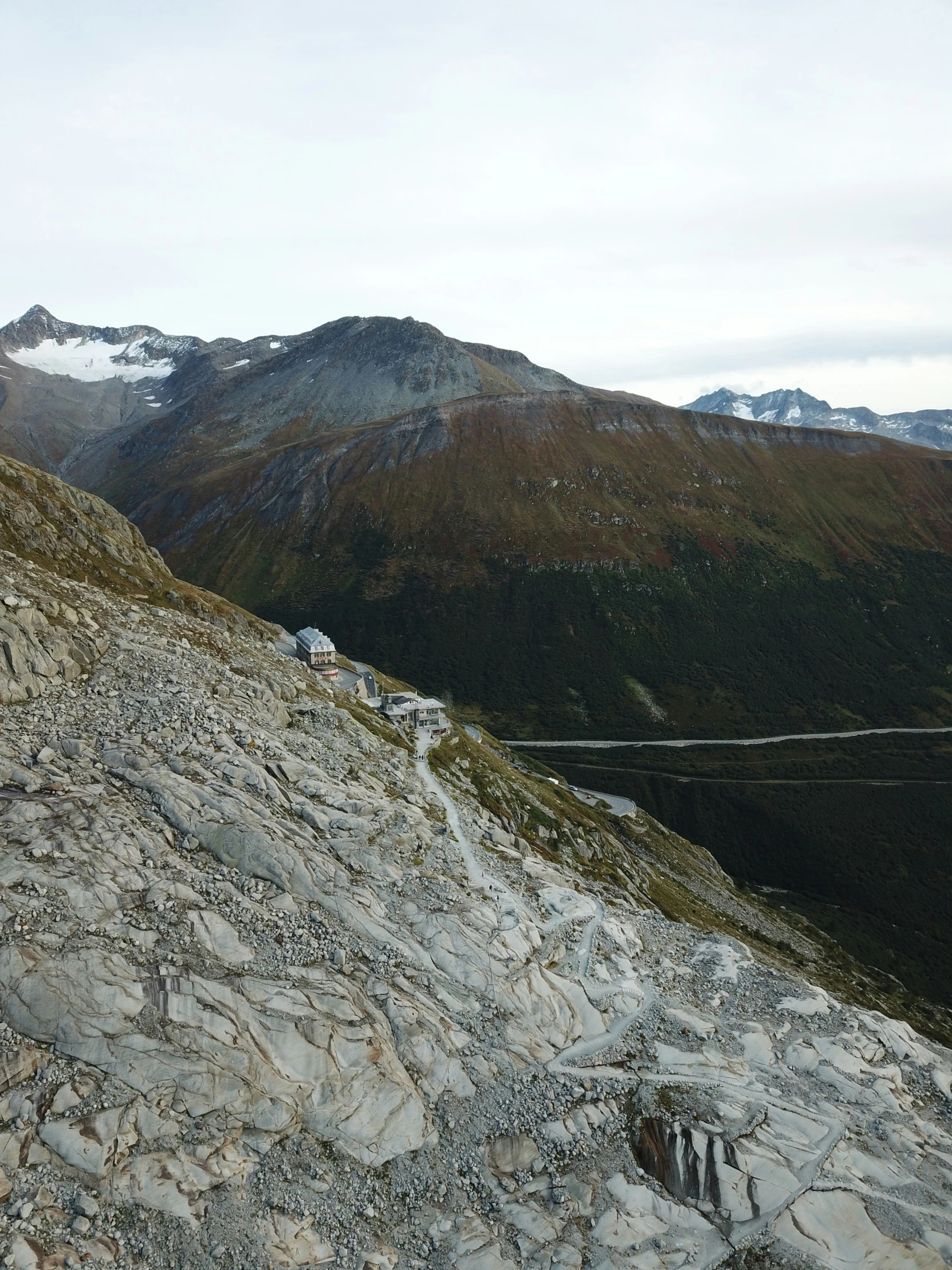 an elevated walkway in the middle of mountains