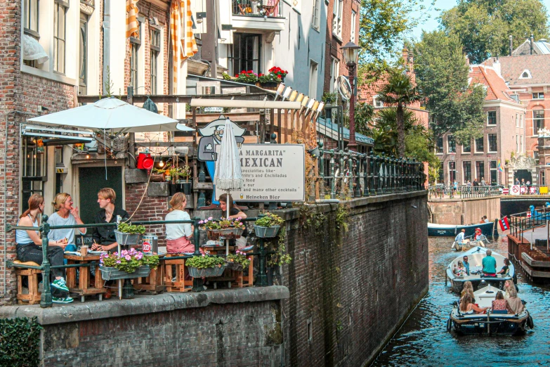 the river is crowded with people sitting on chairs