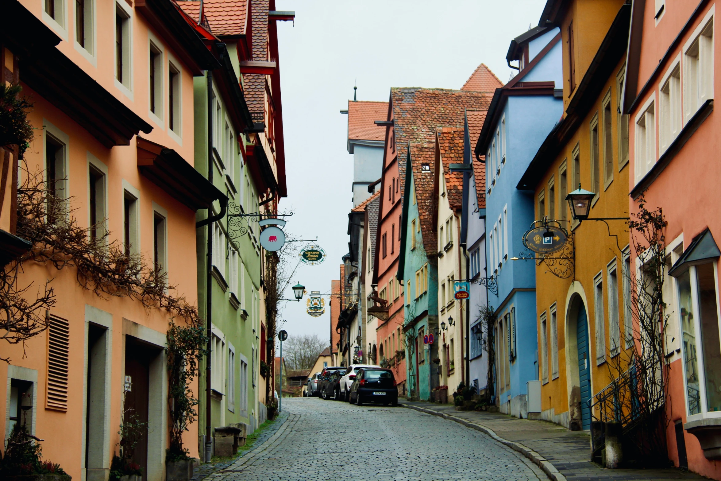 a street lined with colorful, row houses