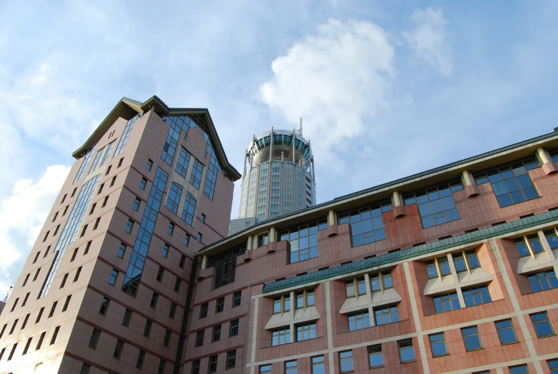 two large buildings stand close to each other