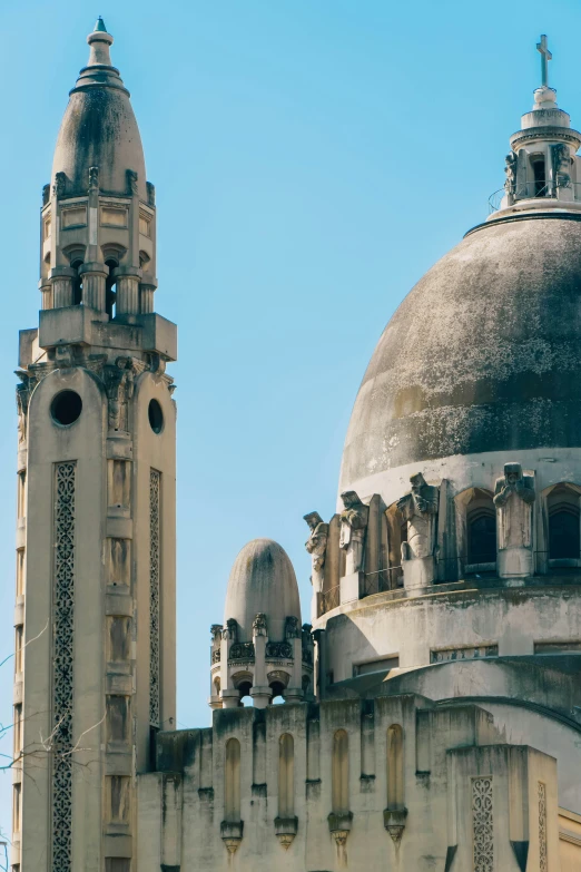 a building with some towers and a blue sky