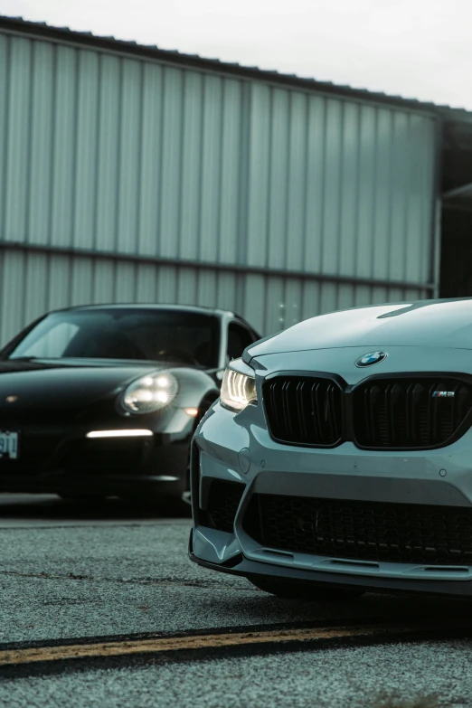 two cars parked next to each other on a road