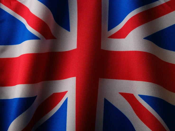 a british flag is pictured with bright red, white and blue colors