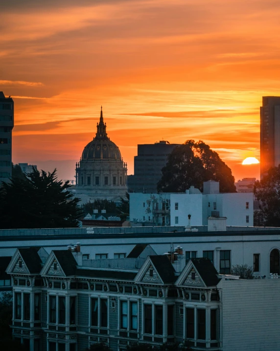 there is a bright red sky over buildings