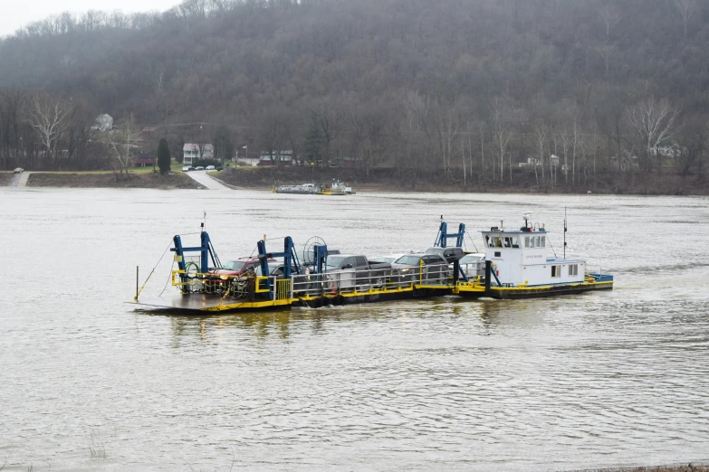 a barge with several parts on the side in the water