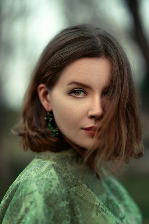 a woman standing outside looking off into the distance