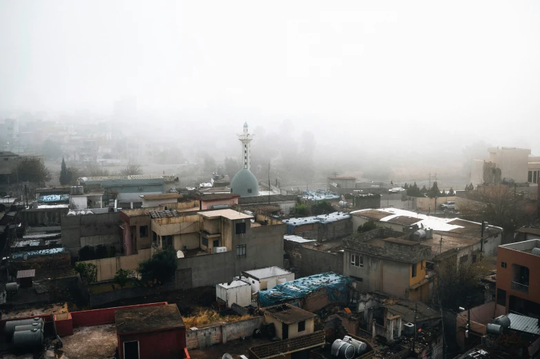 a city on a cloudy day, taken from an apartment building