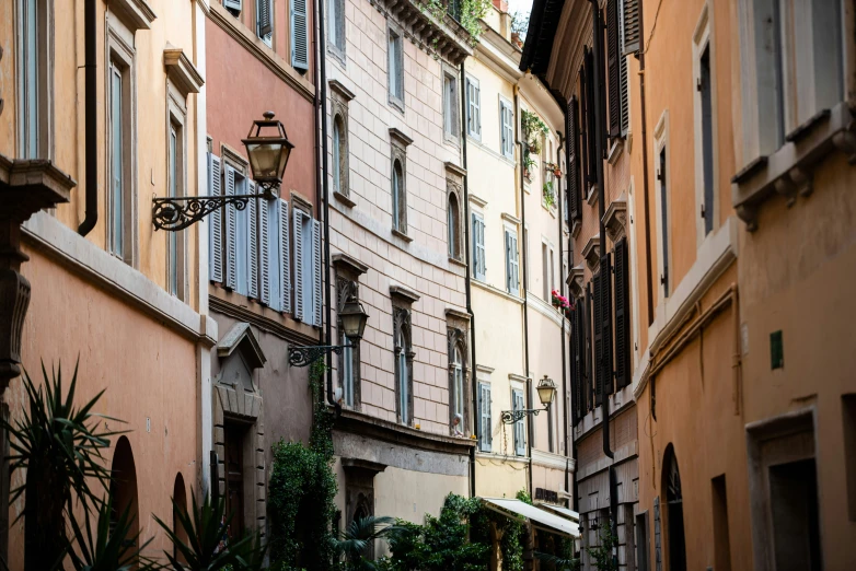 there is a narrow alleyway with two buildings in it