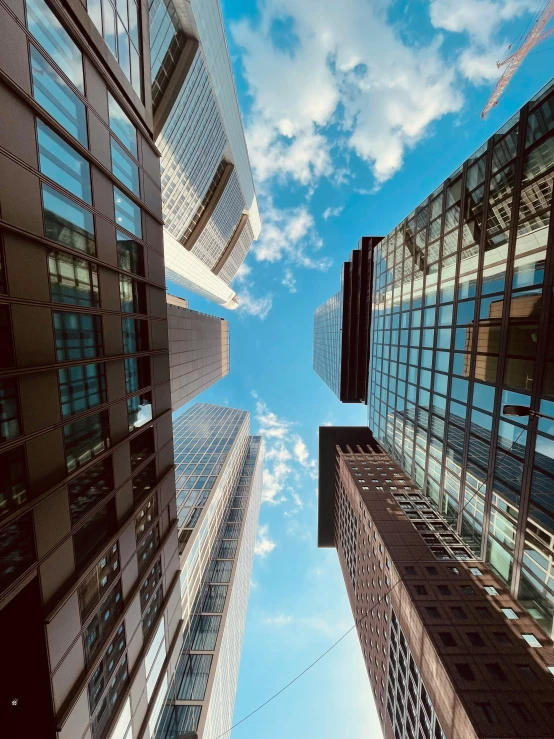 a low angle view of two buildings on the other side