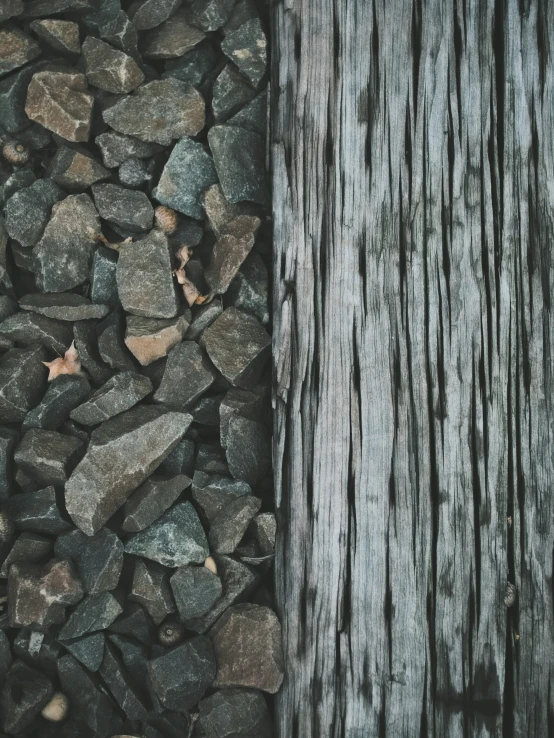 a stone ground with a wooden log in the middle