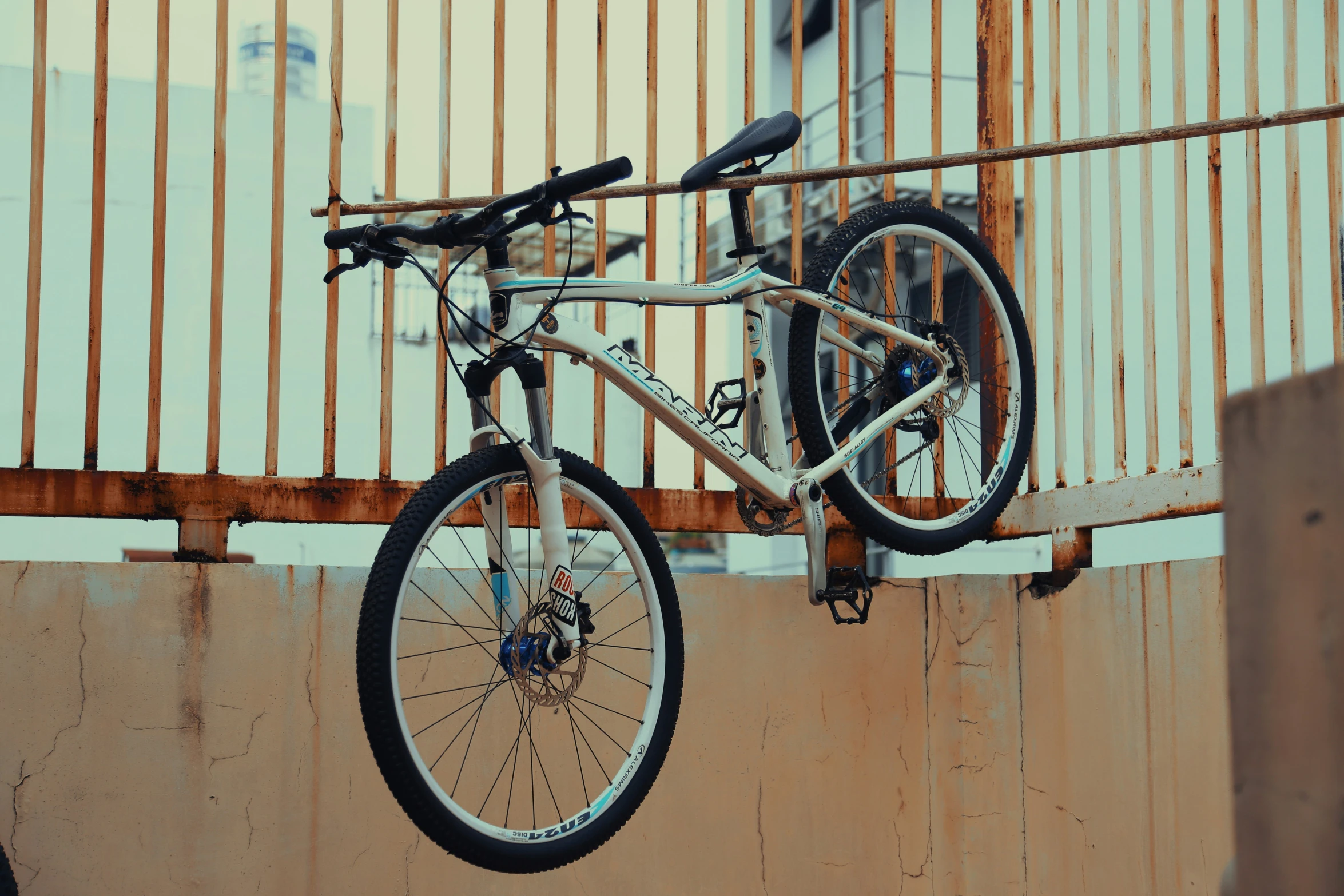 a bike attached to the side of a building