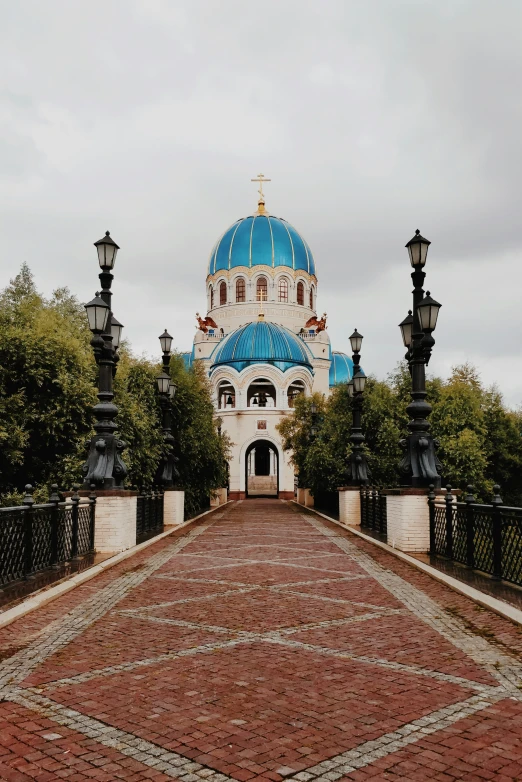 the blue and white building has two towers with small crosses