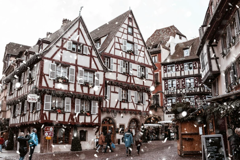 christmas decorations decorate buildings on an old fashioned street