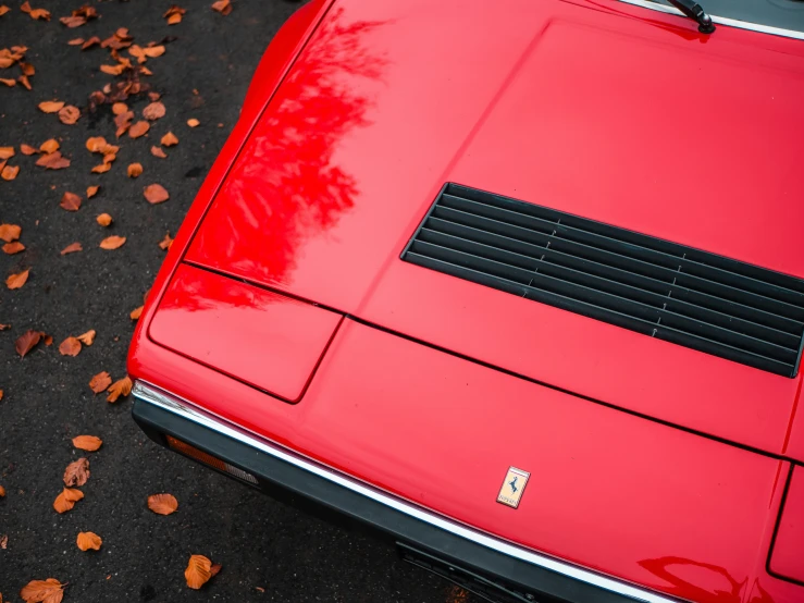 close up po of the roof and exhaust pipe on a red classic car