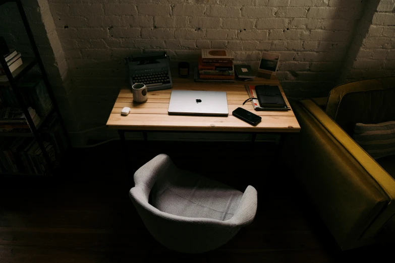 a laptop computer and other personal items on a desk