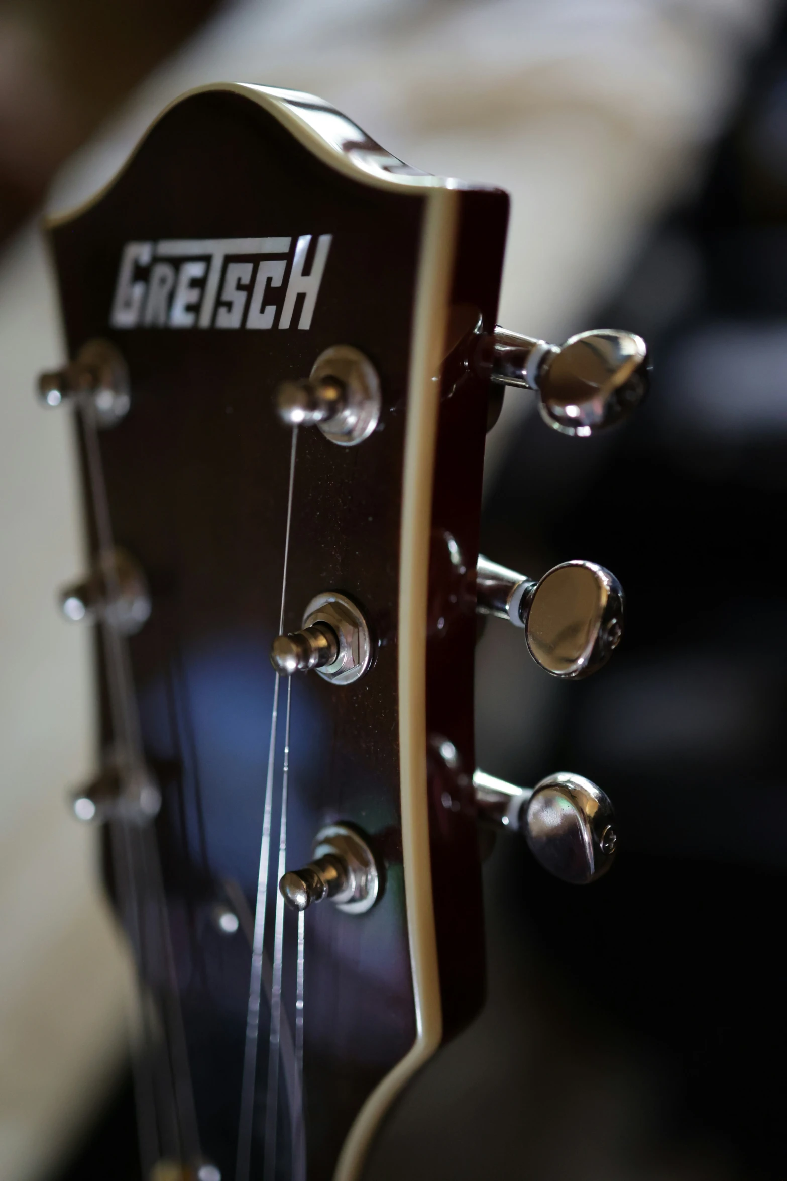 the headstock of an electric guitar and head