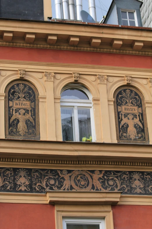 an ornate window is adorned with decorative decorations