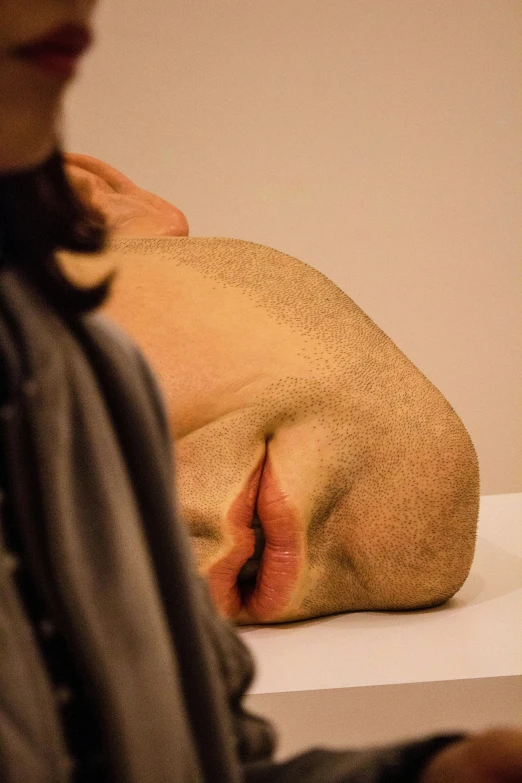 a man is sitting on a table while laying down