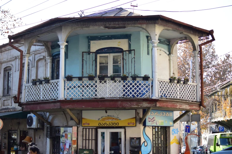 a group of buildings with a couple men standing outside