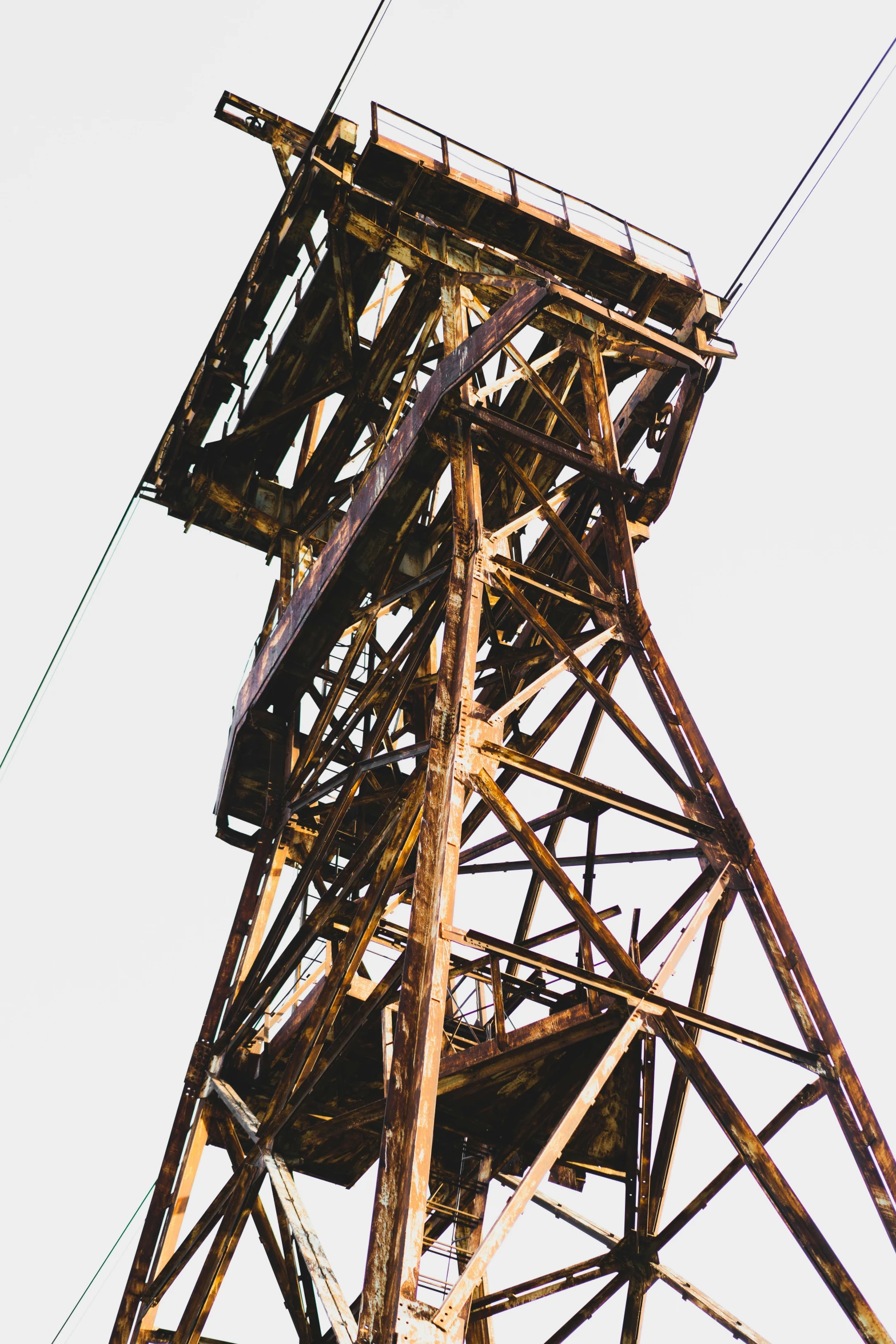 an old steel tower with a sky background