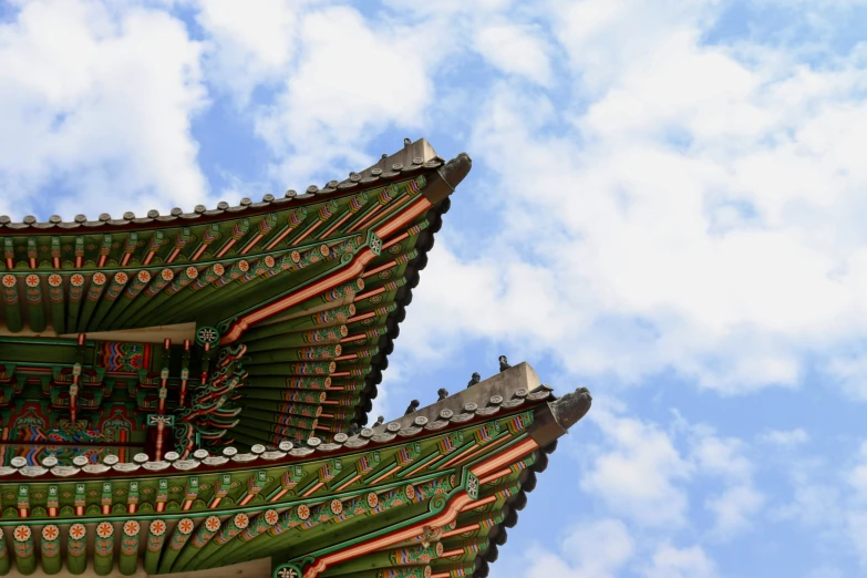 two large asian architectural buildings under the blue sky