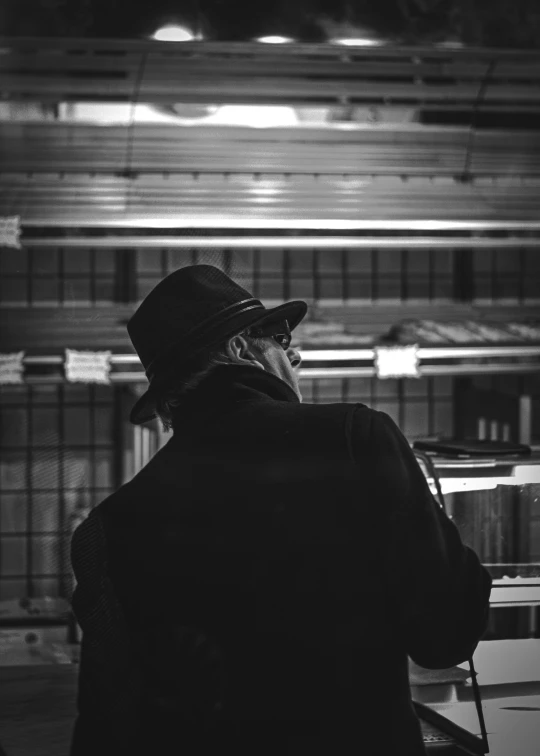 a man standing next to a metal bench