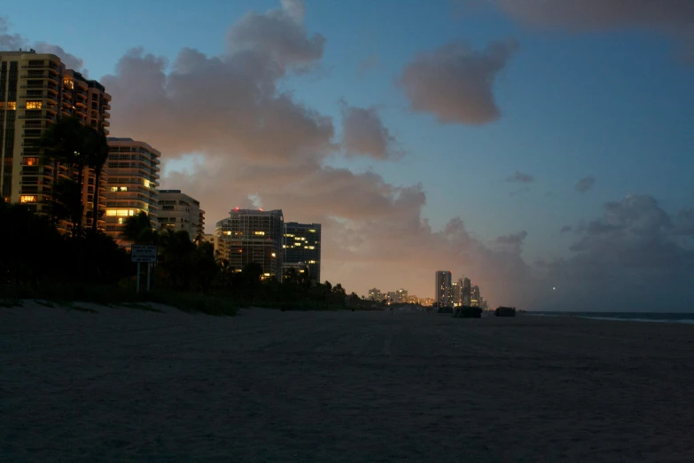 buildings near the water at night near the beach