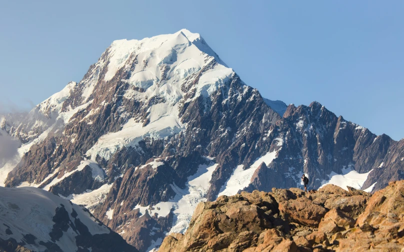 snow covered mountain peaks are seen in the distance