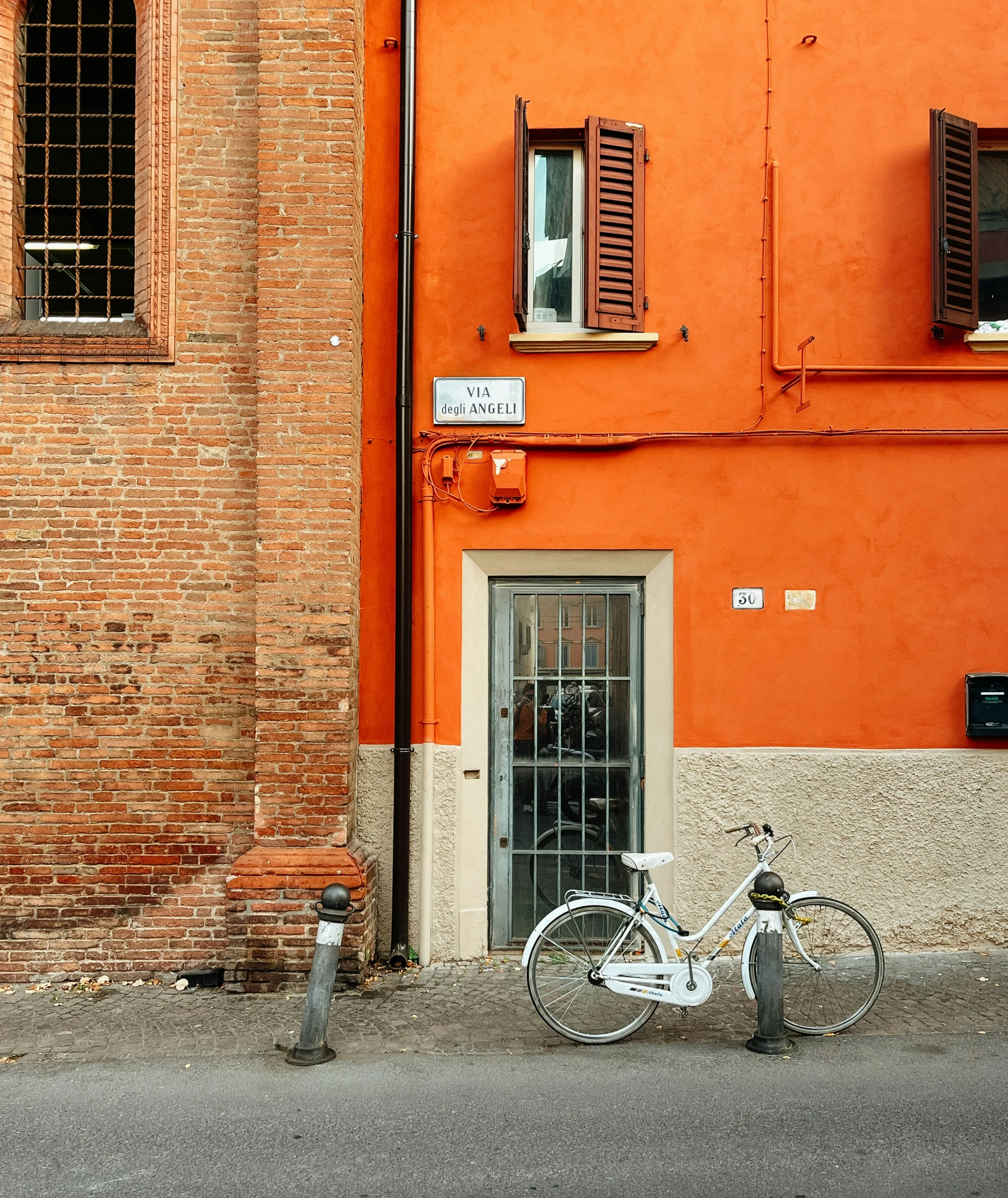 the bicycle is parked next to a fire hydrant