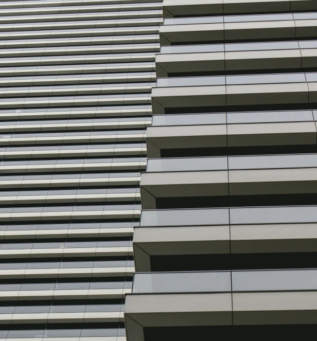 a large grey building is made of concrete blocks