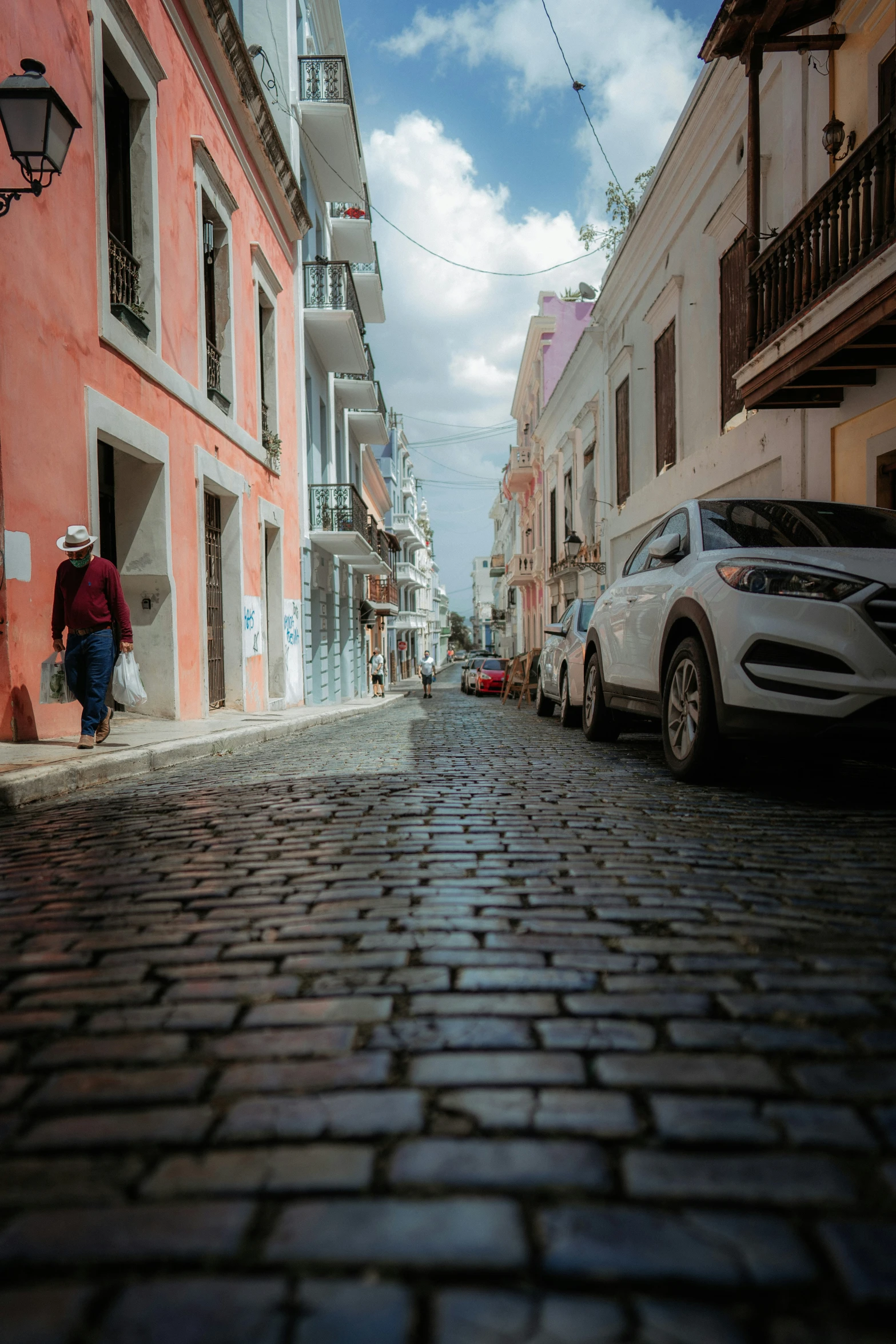 cars parked on the side of a city street