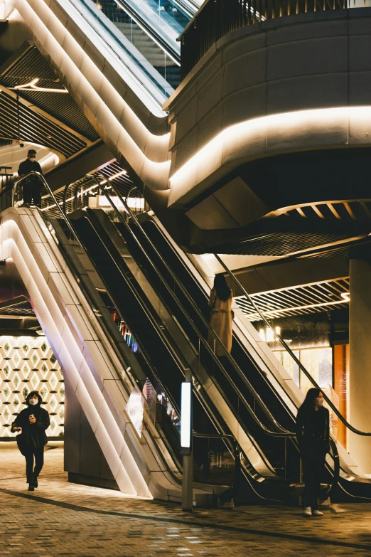 people are walking up a stairway that is located in a subway