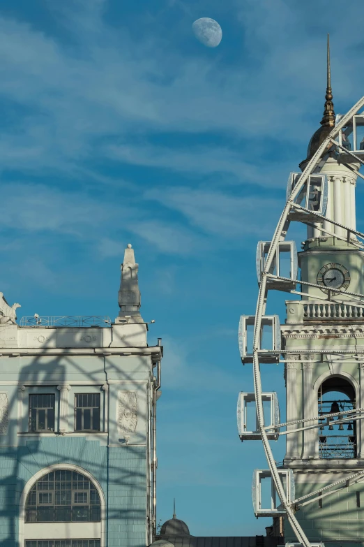 the ferris wheel is sitting outside on a clear day