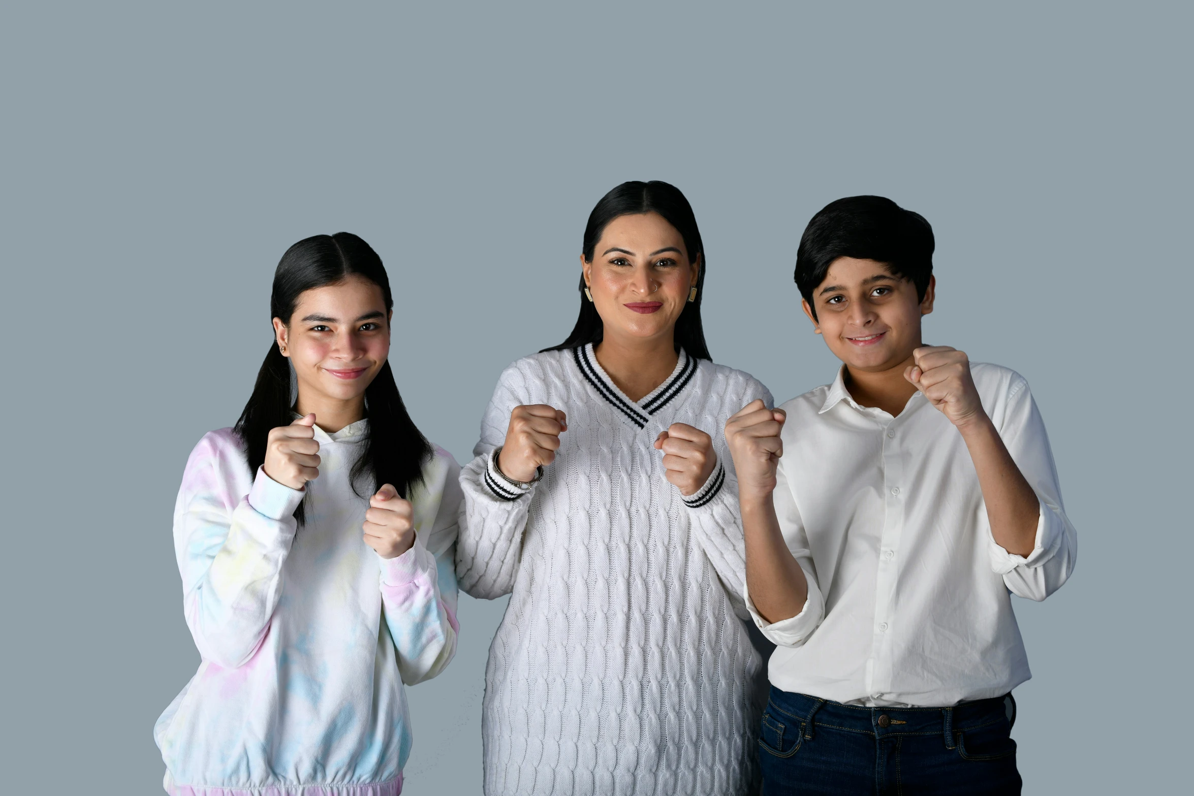 three women are posing for a po with their fists raised