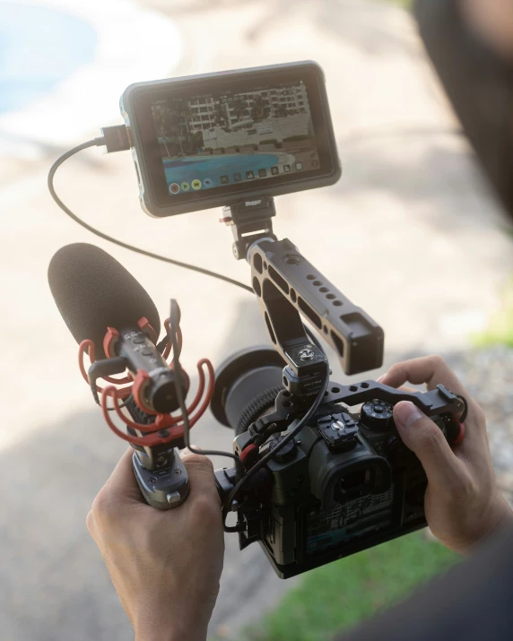 a man holding a cell phone and microphone