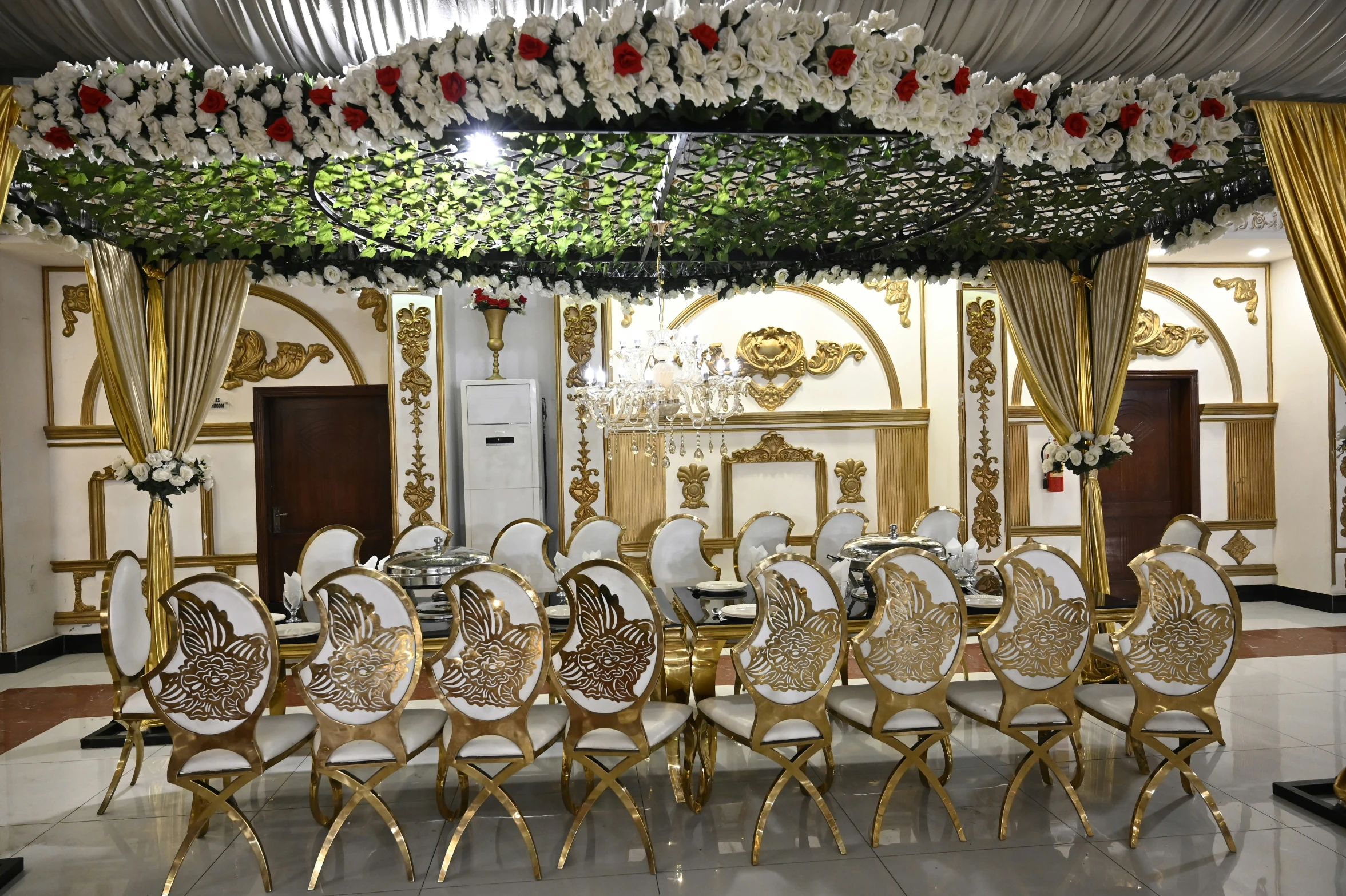 a fancy event with chairs and tables are set